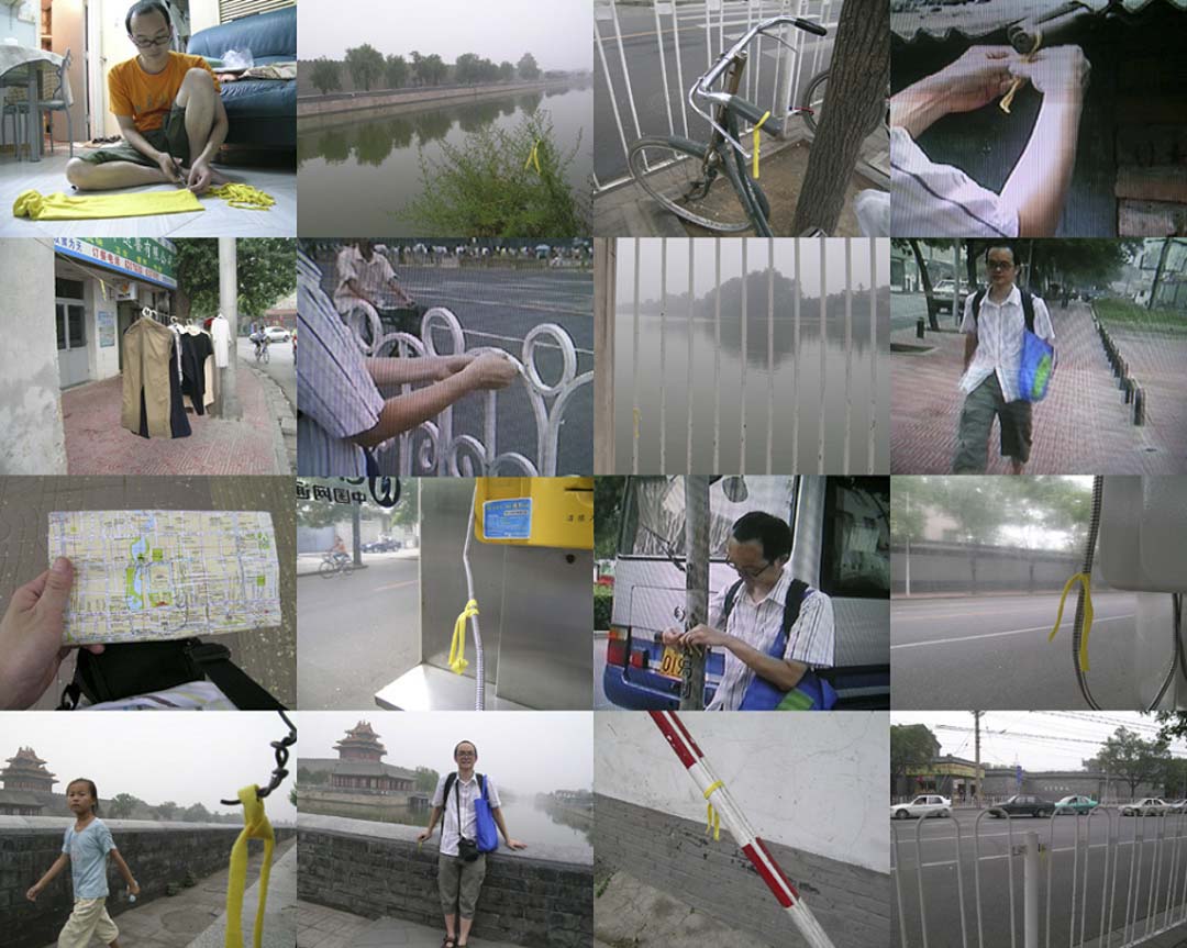 《香港人給中央的禮物》 2005年7月1日在香港銅鑼灣鵝頸橋底,我在七一遊行路線上橫貼了一條黃線,記錄了整天所有遊行人士的腳印。2005年7月17日,圍繞北京天安門廣場週邊,我把七一的黃線剪成很多少絲帶,然後圍繞北京天安門廣場周邊綁了一個圈。