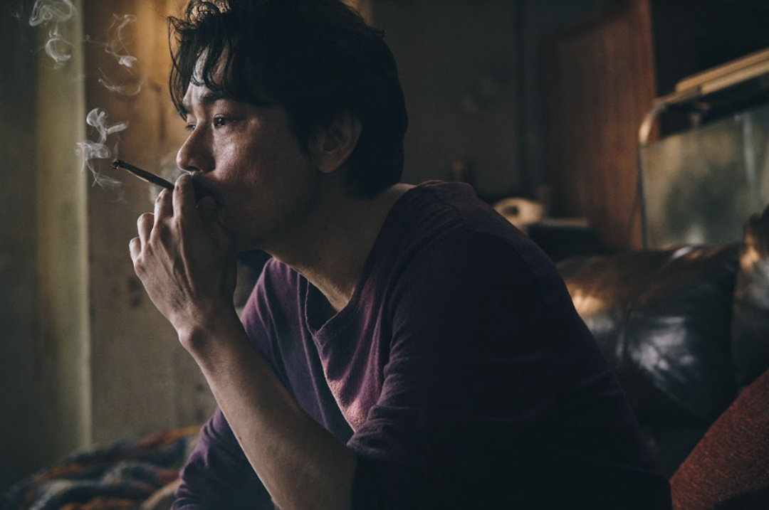 《手捲煙》電影劇照。