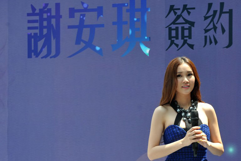 2014年5月,北京,香港歌手谢安琪出席签约内地经理人公司的宣传活动。摄:Tung Star